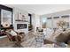 Comfortable living room with a modern fireplace, stylish decor, and access to an outdoor deck at 3000 S Elati St, Englewood, CO 80110