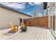 Relaxing outdoor patio with modern fire pit, comfortable seating, and stylish string lights at 3000 S Elati St, Englewood, CO 80110