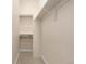 This walk-in closet with shelving and a high and low clothes rod is move-in ready at 3000 S Elati St, Englewood, CO 80110