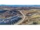 Panoramic aerial view of a new housing development near mountains, highlighting the neighborhood's layout and surrounding nature at 1044 Oleander St, Castle Rock, CO 80109