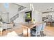 Open-concept living area features high ceilings, modern decor, and a sleek fireplace beneath the TV at 1044 Oleander St, Castle Rock, CO 80109