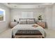 Cozy primary bedroom boasts neutral tones, carpeted floors, ample lighting, and modern decor at 1044 Oleander St, Castle Rock, CO 80109