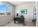 Well-lit home office with a large window offering a scenic view, a modern desk setup, and ample space at 1044 Oleander St, Castle Rock, CO 80109