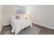 Cozy bedroom features a comfortable bed, side table, and a large window at 1390 N Emerson St # 105, Denver, CO 80218