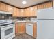 Functional kitchen with light wood cabinetry and appliances at 1390 N Emerson St # 105, Denver, CO 80218