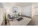 Charming living room featuring sleek laminate floors and minimalist furniture at 1390 N Emerson St # 105, Denver, CO 80218