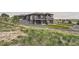 Expansive backyard with a multi-level patio area, perfect for outdoor dining and relaxation in a private setting at 10689 Shadow Pines Rd, Parker, CO 80138