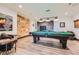Basement recreational area with pool table, and vintage decorations at 10689 Shadow Pines Rd, Parker, CO 80138