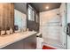 Modern bathroom with black and white tiles, glass shower, and contemporary design at 10689 Shadow Pines Rd, Parker, CO 80138