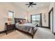 Cozy bedroom with plush carpeting, a large window with a view, and a comfortable, well-appointed bed at 10689 Shadow Pines Rd, Parker, CO 80138