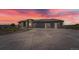 Spectacular home boasting a modern design with a spacious driveway and mountain views at sunset at 10689 Shadow Pines Rd, Parker, CO 80138