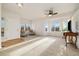 Inviting living room featuring large windows, neutral paint, and carpet at 1300 Iris Cir, Broomfield, CO 80020