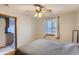 Bedroom with a ceiling fan, neutral walls, and a cozy bedspread, with a window offering natural light at 3061 W 18Th Ave, Denver, CO 80204