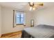 Bright bedroom features wood floors, fan, and large window that offers plenty of natural light at 3061 W 18Th Ave, Denver, CO 80204