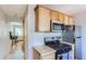 Well-equipped kitchen with stainless steel appliances, gas range, wooden countertops and cabinetry at 3061 W 18Th Ave, Denver, CO 80204
