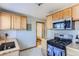 Traditional kitchen featuring butcher block countertops and stainless steel appliances at 3061 W 18Th Ave, Denver, CO 80204
