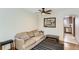 Cozy living room with a striped rug, comfortable seating and an inviting archway to the kitchen at 3061 W 18Th Ave, Denver, CO 80204