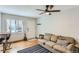 Inviting living room with sofa, wooden floors, ceiling fan and natural light at 3061 W 18Th Ave, Denver, CO 80204
