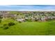 Expansive aerial view of a neighborhood showcasing the community's layout and scenic surroundings at 12888 Buckhorn Creek St, Parker, CO 80134