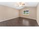 Spacious bedroom with ceiling fan and large window at 12888 Buckhorn Creek St, Parker, CO 80134