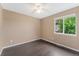 Bedroom with ceiling fan and window with backyard view at 12888 Buckhorn Creek St, Parker, CO 80134