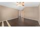 Spacious bedroom with hardwood floors and ceiling fan at 12888 Buckhorn Creek St, Parker, CO 80134