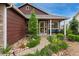 Inviting front porch with colorful landscaping leading to the home's entrance at 12888 Buckhorn Creek St, Parker, CO 80134