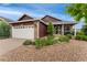 Charming single-Gathering home with a well-manicured lawn, stone accents, and a two-car garage at 12888 Buckhorn Creek St, Parker, CO 80134