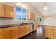 Beautiful kitchen features stainless appliances, granite counters and hardwood floors at 12888 Buckhorn Creek St, Parker, CO 80134