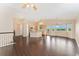 Open kitchen and living area with stainless steel appliances, island seating, and a breakfast nook at 12888 Buckhorn Creek St, Parker, CO 80134