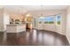 Bright open-concept kitchen with wood cabinets, an island, and lots of natural light at 12888 Buckhorn Creek St, Parker, CO 80134