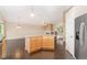 Kitchen boasts granite countertops, center island and hardwood floors at 12888 Buckhorn Creek St, Parker, CO 80134