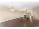 Spacious living room featuring dark wood floors, fireplace, and high ceilings at 12888 Buckhorn Creek St, Parker, CO 80134