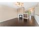 Cozy living room featuring dark wood floors, fireplace, and bright natural light at 12888 Buckhorn Creek St, Parker, CO 80134