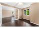 Office space with dark wood floors, bright windows, and glass French doors at 12888 Buckhorn Creek St, Parker, CO 80134