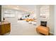 View of the open basement featuring a living area, dining space, and neutral color palette at 26631 E Arbor Dr, Aurora, CO 80016