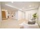 Expansive basement featuring neutral decor, a cozy seating area, and a staircase at 26631 E Arbor Dr, Aurora, CO 80016