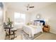Comfortable bedroom with a large window, stylish bed, and tasteful decor, perfect for relaxation at 26631 E Arbor Dr, Aurora, CO 80016