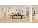 Elegant dining area seamlessly connecting the kitchen and living spaces in an open concept design at 26631 E Arbor Dr, Aurora, CO 80016