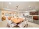 Well-lit dining area and bar area of the basement, perfect for entertaining guests at 26631 E Arbor Dr, Aurora, CO 80016