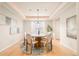 Elegant dining room with coffered ceilings, a chandelier, and a round table with seating for six at 26631 E Arbor Dr, Aurora, CO 80016