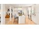 Modern kitchen with stainless steel appliances, large island, and views into living and dining areas at 26631 E Arbor Dr, Aurora, CO 80016