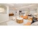 Spacious basement living area with modern furniture, neutral carpet, and recessed lighting at 26631 E Arbor Dr, Aurora, CO 80016