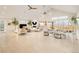 Bright living room showcasing vaulted ceilings, a fireplace, and access to a terrace at 26631 E Arbor Dr, Aurora, CO 80016