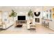 Stylish living room featuring a stone fireplace, modern decor, and comfortable seating at 26631 E Arbor Dr, Aurora, CO 80016