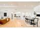 Open living space showcases a modern interior with light wood floors, an open kitchen and a dining area at 26631 E Arbor Dr, Aurora, CO 80016