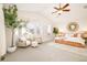 Bright main bedroom with vaulted ceilings, neutral decor, sitting area and large windows for natural light at 26631 E Arbor Dr, Aurora, CO 80016