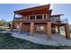 Enjoy outdoor living with a spacious covered deck overlooking landscaped yard and lower-level access at 7482 Sleeping Bear Trl, Littleton, CO 80125