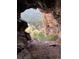 Scenic cave view overlooking lush greenery and natural landscape, offering a unique outdoor experience at 5425 Us Highway 285, Morrison, CO 80465