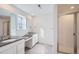 Bathroom with double vanity, a shower, and gray tile floors at 4620 Thistle Dr, Brighton, CO 80601